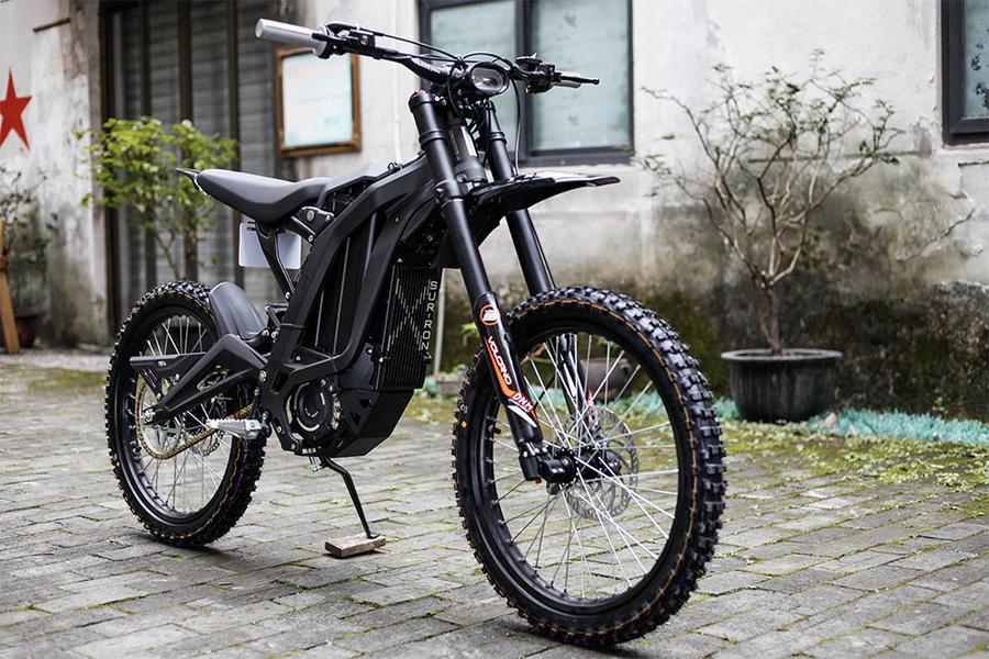 black surron x series with optional rear hugger and chain guard