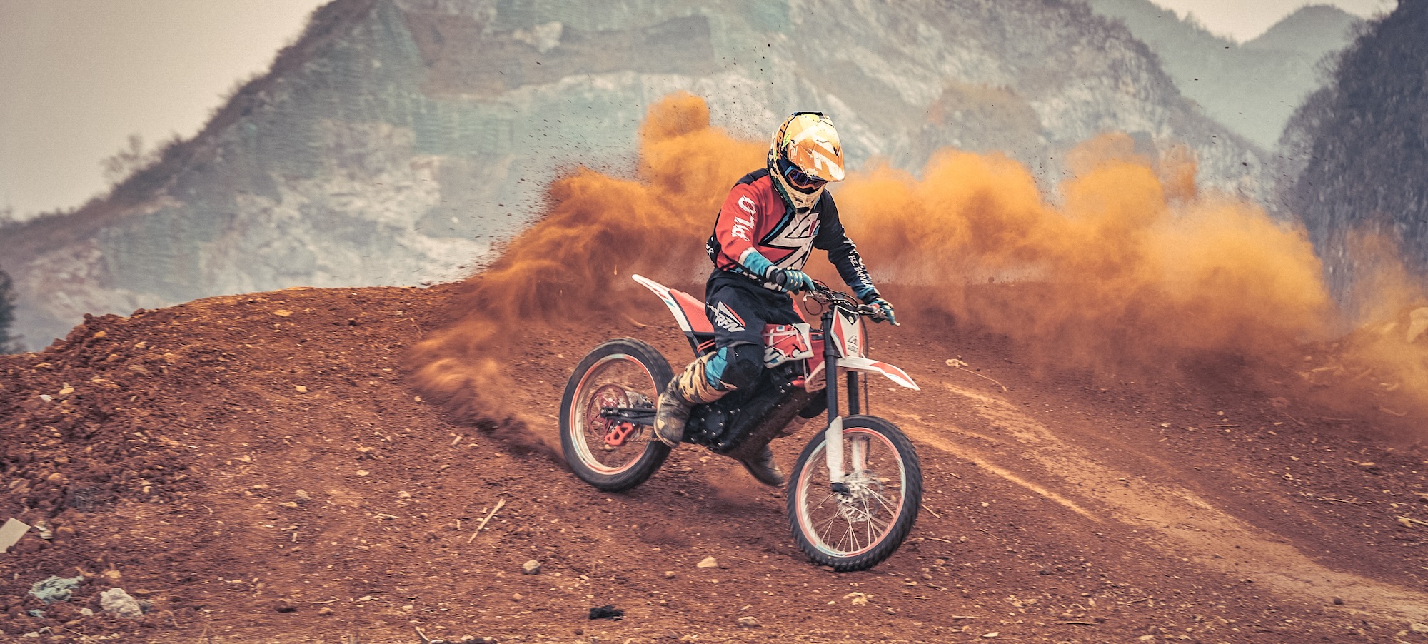 motorbike racing rider competing on RFN Rally Pro in rough terrain