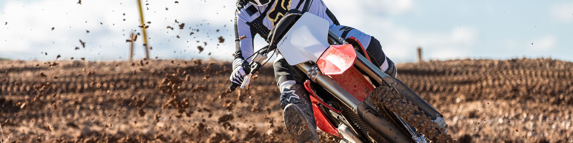 motorbike racing rider competing on stark vary in rough terrain