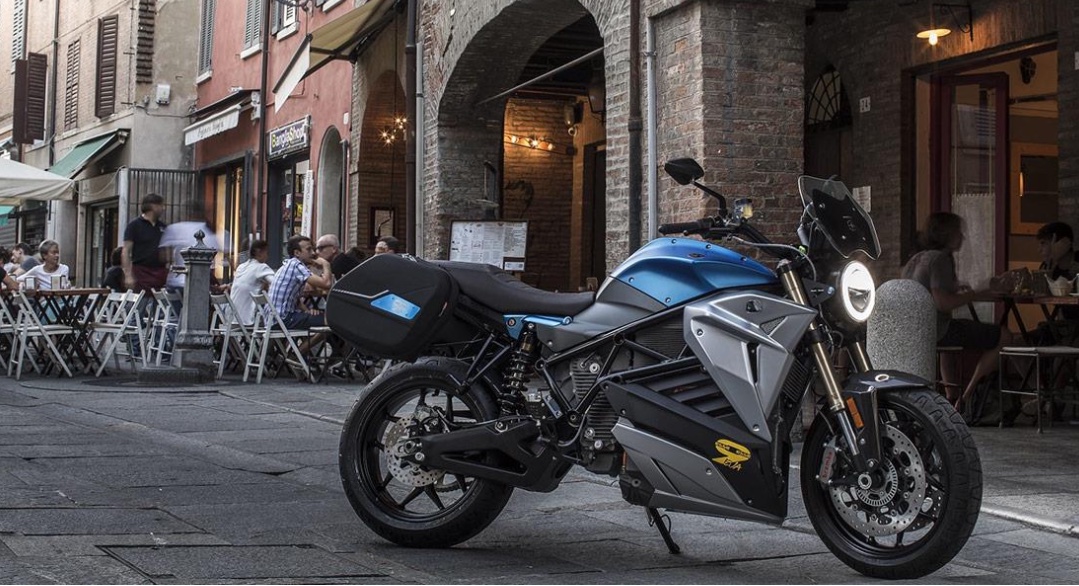 electric motorbike parked outside cafe